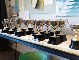 Table of trophies being awarded at prizegivng