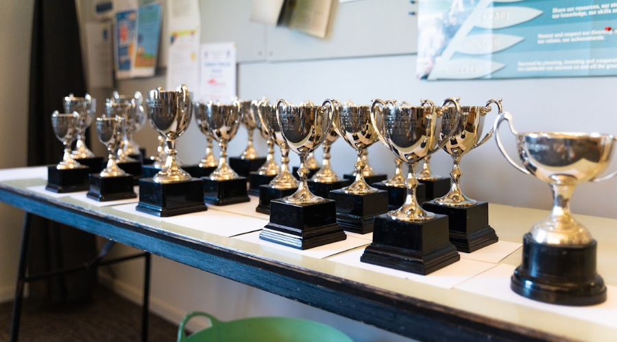 Table of trophies being awarded at prizegivng